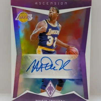 Panini Ascension Magic Johnson autographed trading card featuring a bold blue signature on a sticker autograph, presented in good...