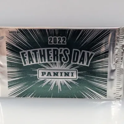 Unopened pack of 2022 Panini Father's Day promotional sports trading cards in silver foil packaging.