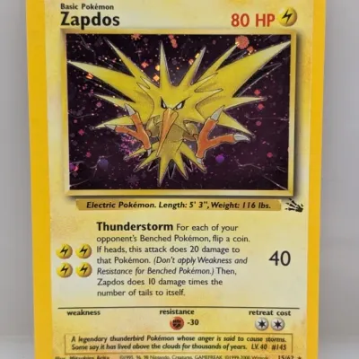 Vintage 1999 Pokémon Fossil set holographic Zapdos trading card, numbered 15/62, featuring artwork by Mitsuhiro Arita.