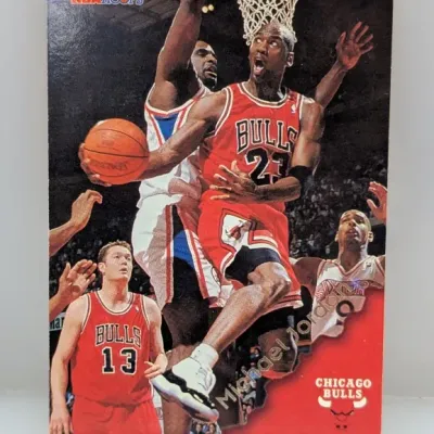 1996-97 NBA Hoops Michael Jordan #20 trading card featuring an in-game action photo of Jordan driving to the basket.