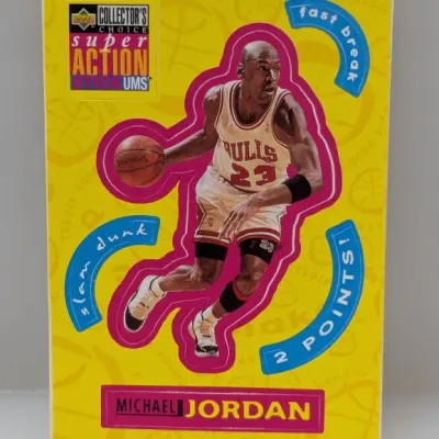1995-96 Upper Deck Collector's Choice Super Action Stick-Ums Michael Jordan sticker card featuring a bright yellow background and...