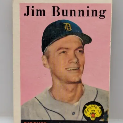 1958 Topps Jim Bunning #375 vintage baseball card, featuring the Detroit Tigers pitcher against a pink background.