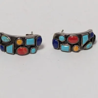 Pair of Southwestern sterling silver J-hoop post earrings featuring multi-stone inlay including turquoise, lapis, coral, and spiny oyster...
