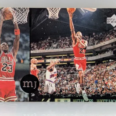 Upper Deck Michael Jordan "MJ Decade of Dominance" basketball trading card, featuring two split-action photos of Jordan in his...