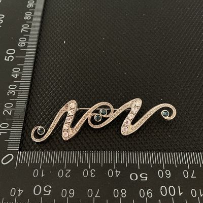 Silver-Tone Rhinestone Swirl Brooch Pin