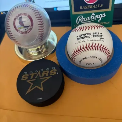 Baseball and Hockey Memorabilia Lot –  Baseball, Cardinals Display Ball & Dallas Stars Puck