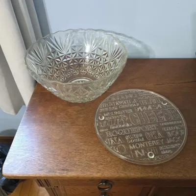 Large clear pressed glass serving bowl.Cheese-themed serving board.
