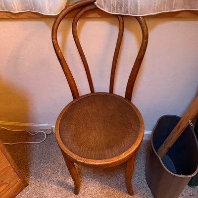 Sale Photo Thumbnail #69: Vintage Thonet-style bentwood chair featuring a loop back design and circular wooden seat, showing light age-appropriate finish wear.