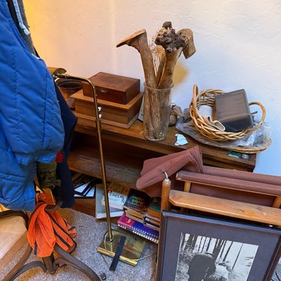 Sale Photo Thumbnail #11: Eclectic assortment of home decor and household items including a brass floor lamp, wooden storage boxes, a framed black-and-white photograph, a woven basket, and decorative driftwood.