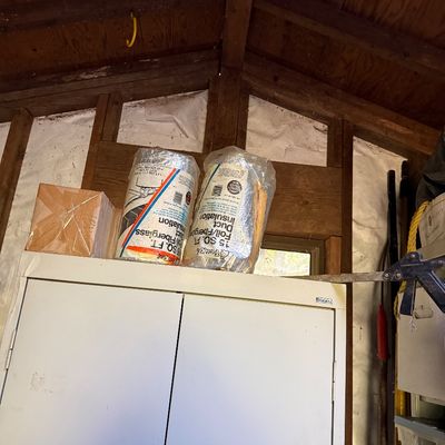 Sale Photo Thumbnail #75: Two rolls of Frost King foil and fiberglass duct insulation sitting atop a white metal storage cabinet.