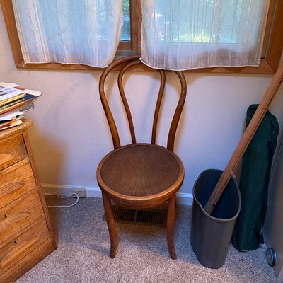 Sale Photo Thumbnail #9: Vintage bentwood Thonet-style side chair with a dark round wooden seat.