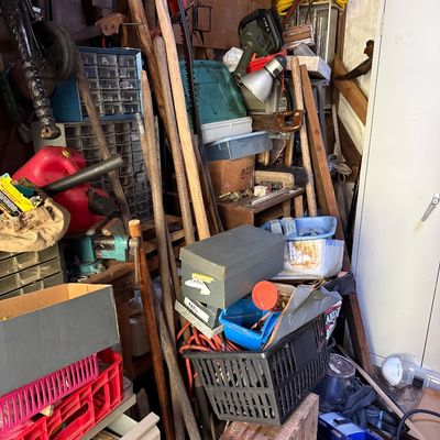 Sale Photo Thumbnail #72: Assorted workshop and garden tools, featuring long-handled implements, storage crates, small parts organizers, and power tools.