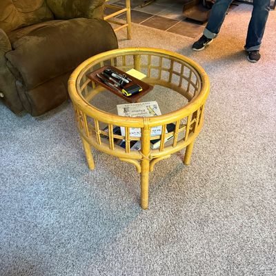 Sale Photo Thumbnail #20: Vintage round rattan and bamboo coffee table with a inset glass top and lower display shelf.