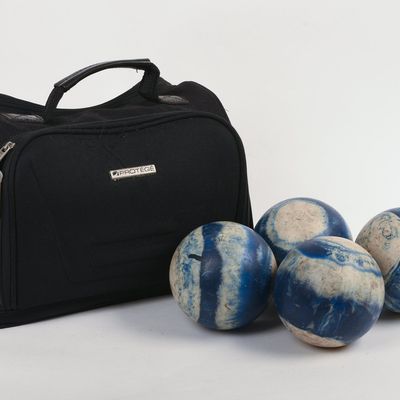 FOUR CANDLEPIN BOWLING BALLS.