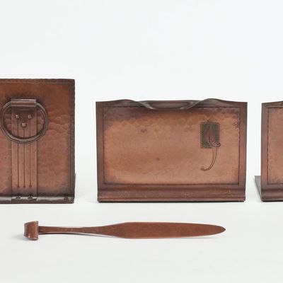 TWO PAIRS OF ROYCROFT HAMMERED COPPER BOOKENDS AND A LETTER OPENER.