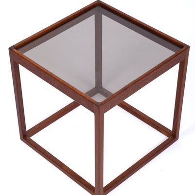 KURT OSTERVIG TEAK AND SMOKED GLASS SIDE TABLE.