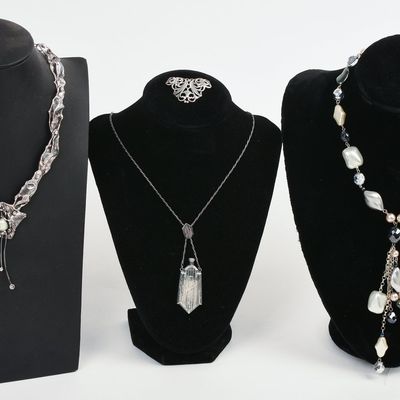 THREE NECKLACES AND A BROOCH.