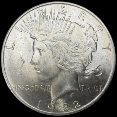 Sale Photo Thumbnail #22: Obverse side of a 1922 Peace Silver Dollar coin in uncirculated condition.