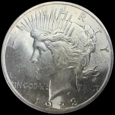 Sale Photo Thumbnail #26: Obverse side of a 1923 United States Peace Silver Dollar featuring Lady Liberty.