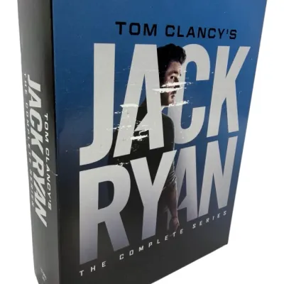 Sale Photo Thumbnail #195: Tom Clancy's Jack Ryan: The Complete Series DVD box set in a blue and black slipcase with some light wear along the cover.