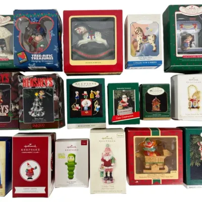 Sale Photo Thumbnail #50: Collection of vintage boxed Hallmark Keepsake and Enesco Christmas tree ornaments, primarily dating from the 1980s and 1990s.