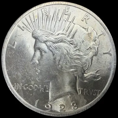 Sale Photo Thumbnail #23: 1928 Peace Silver Dollar coin displaying obverse details with Lady Liberty and minor surface wear.