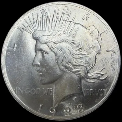 Sale Photo Thumbnail #30: Obverse side of a 1923 Peace silver dollar featuring the profile of Lady Liberty.