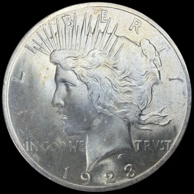 Sale Photo Thumbnail #32: Obverse side of a 1923 United States Peace Silver Dollar featuring the profile of Lady Liberty.