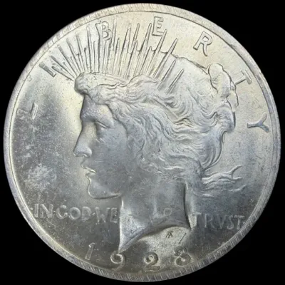 Sale Photo Thumbnail #28: 1928 United States Peace silver dollar, obverse side featuring Liberty.
