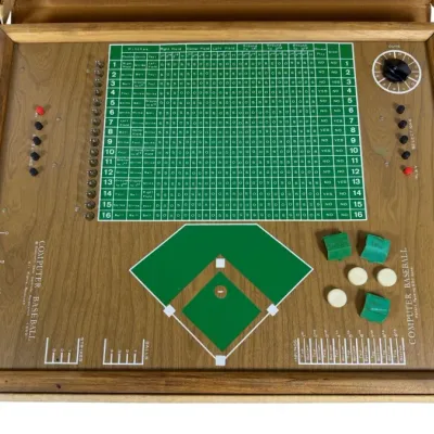 Sale Photo Thumbnail #49: Vintage 1969 Computer Baseball tabletop game by Electronic Data Controls Corporation housed in a wooden frame with printed board, lights, dials, and game pieces.