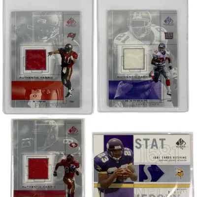 Sale Photo Thumbnail #18: Set of four Upper Deck SP Game Used Edition football trading cards featuring authentic jersey fabric swatches in protective sleeves.