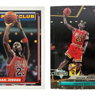 Sale Photo Thumbnail #44: Pair of Michael Jordan trading cards, featuring a 1993 Topps 50 Point Club card and a 1992-93 Fleer Ultra Dunk Rank card.