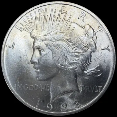 Sale Photo Thumbnail #35: Obverse side of a 1923 Peace silver dollar featuring Liberty facing left.