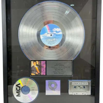 Sale Photo Thumbnail #45: RIAA-certified platinum record award for Ralph Tresvant's self-titled 1990 album, presented to Wade Norton in a black wooden frame.