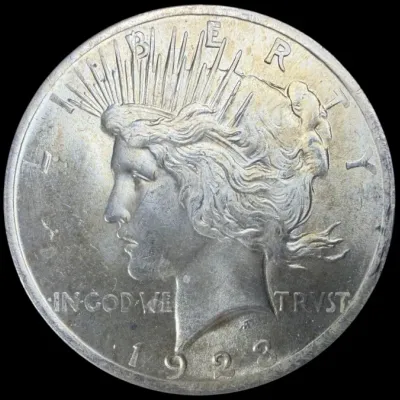 Sale Photo Thumbnail #31: 1923 Peace silver dollar featuring the obverse profile of Lady Liberty.