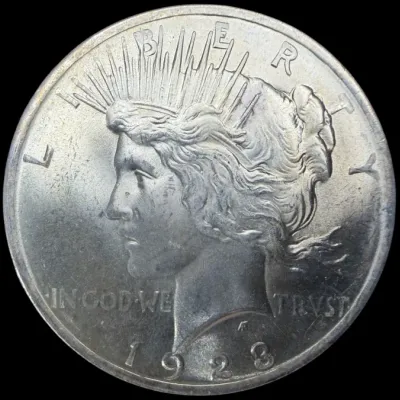 Sale Photo Thumbnail #27: 1923 Peace silver dollar featuring the obverse profile of Lady Liberty.