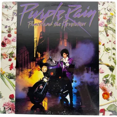 Sale Photo Thumbnail #135: Vinyl album cover of Prince and the Revolution's 'Purple Rain,' released in 1984, preserved in shrink wrap.