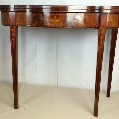 Sale Photo Thumbnail #6: Antique Hepplewhite-style fold-over console or game table with marquetry inlay details and tapered legs.