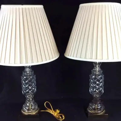 Sale Photo Thumbnail #44: Pair of vintage cut crystal table lamps featuring diamond-patterned stems and pleated cream lampshades.
