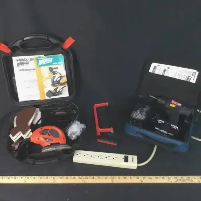 Sale Photo Thumbnail #68: Black & Decker Mouse sander set with hard case, Ryobi 12V cordless drill set in soft case, mini hacksaw, and power strip.