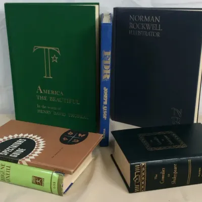 Sale Photo Thumbnail #93: A collection of vintage hardcover books, including Norman Rockwell Illustrator, America the Beautiful, and The Comedies of Shakespeare.