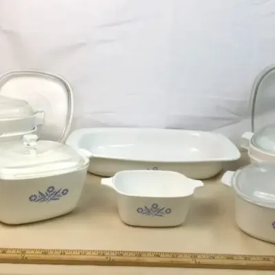 Sale Photo Thumbnail #23: Vintage Corning Ware Cornflower Blue casserole dishes and baking pans with glass lids, featured in various sizes.