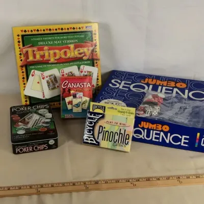 Sale Photo Thumbnail #11: Collection of tabletop games and card sets, including Tripoley Deluxe Mat Version, Jumbo Sequence, Canasta, Bicycle Pinochle, and a tin of professional poker chips.
