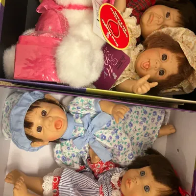 Sale Photo Thumbnail #178: Collection of vintage-style collectible baby dolls and plush toys, including Lee Middleton and Sweet Thoughts branded items in original boxes.