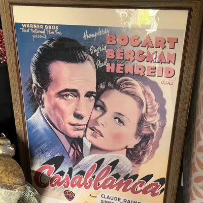 Sale Photo Thumbnail #255: Framed French movie poster print for the classic film Casablanca, featuring Humphrey Bogart and Ingrid Bergman in a wood frame.