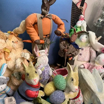 Sale Photo Thumbnail #164: Collection of vintage Easter bunny decorations, including papier-mâché figures, plush rabbits, sock monkeys, and decorative eggs.