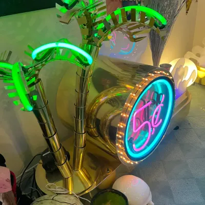 Sale Photo Thumbnail #157: Vintage neon palm tree floor lamp with polished brass finish and illuminated 5-cent sign graphic.
