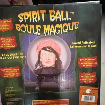 Sale Photo Thumbnail #79: Vintage Gemmy Spirit Ball animatronic Halloween prop in original retail box, featuring light-up eyes, sound activation, and moving head.