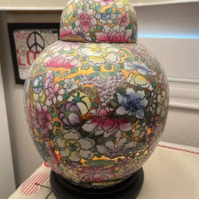 Sale Photo Thumbnail #233: Vintage Chinese Famille Rose Thousand Flowers ceramic ginger jar table lamp mounted on a dark wooden base.