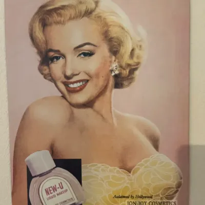 Sale Photo Thumbnail #234: Vintage-style tin metal sign featuring a classic Jon-Joy Cosmetics advertisement with Marilyn Monroe.
